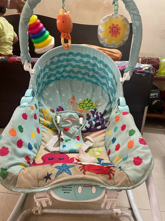 Soothe, entertain, and protect your baby with the INFANTSO Baby Rocker & Bouncer—complete with calming vibrations, music, a mosquito net, and more!