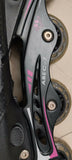 Close-up of a rollerblade with ABEC-7 bearings on a dark background