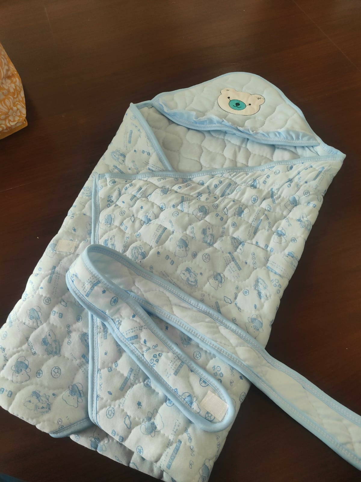Light blue baby wrap with bear design 