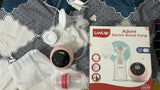 Luvlap Adore electric breast pump with packaging on a patterned surface