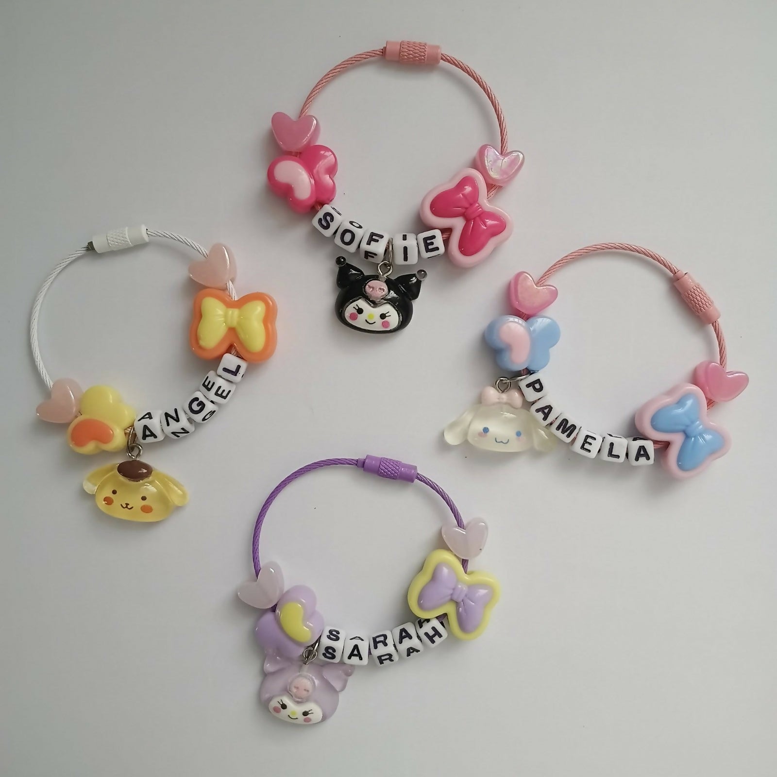 Set of colorful hair ties with cartoon characters and names 