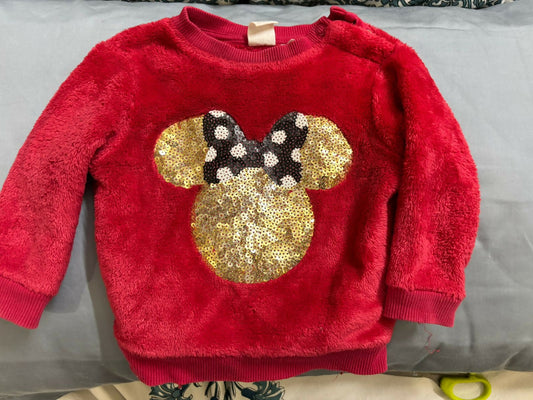Wrap your little one in warmth and magic with this soft faux fur sweater from H&amp;M’s Disney collection.

