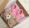 Crochet baby booties and bear set.