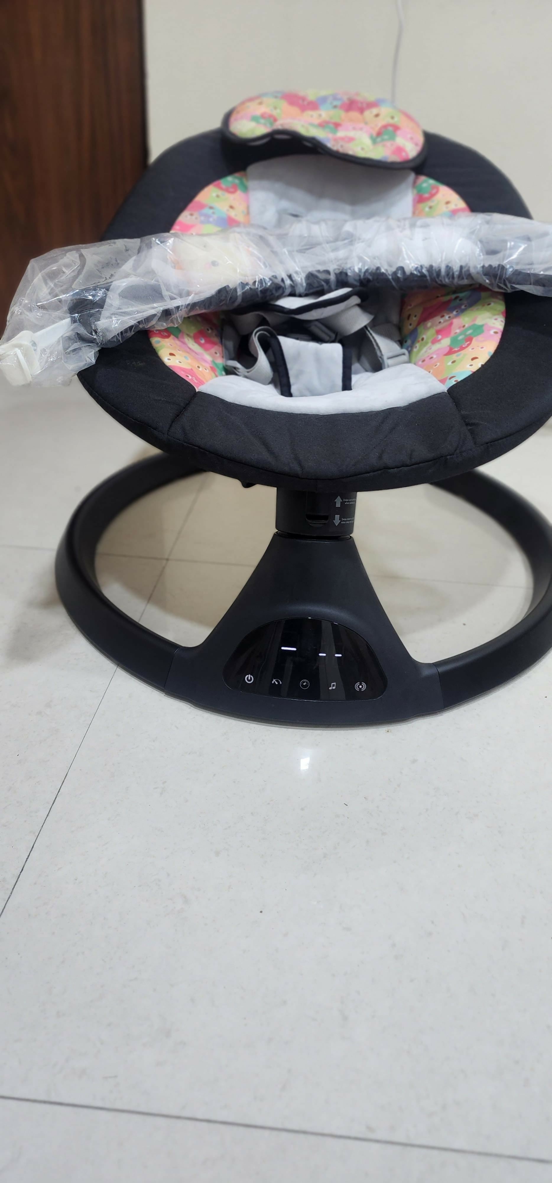 Explore the FIRSTCRAWL Electric Baby Swing, featuring Bluetooth connectivity, remote control operation, 5 swing speeds, soothing music options, and a secure harness for infants, ensuring comfort and safety.