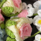 Close-up of crocheted flowers in various colors 