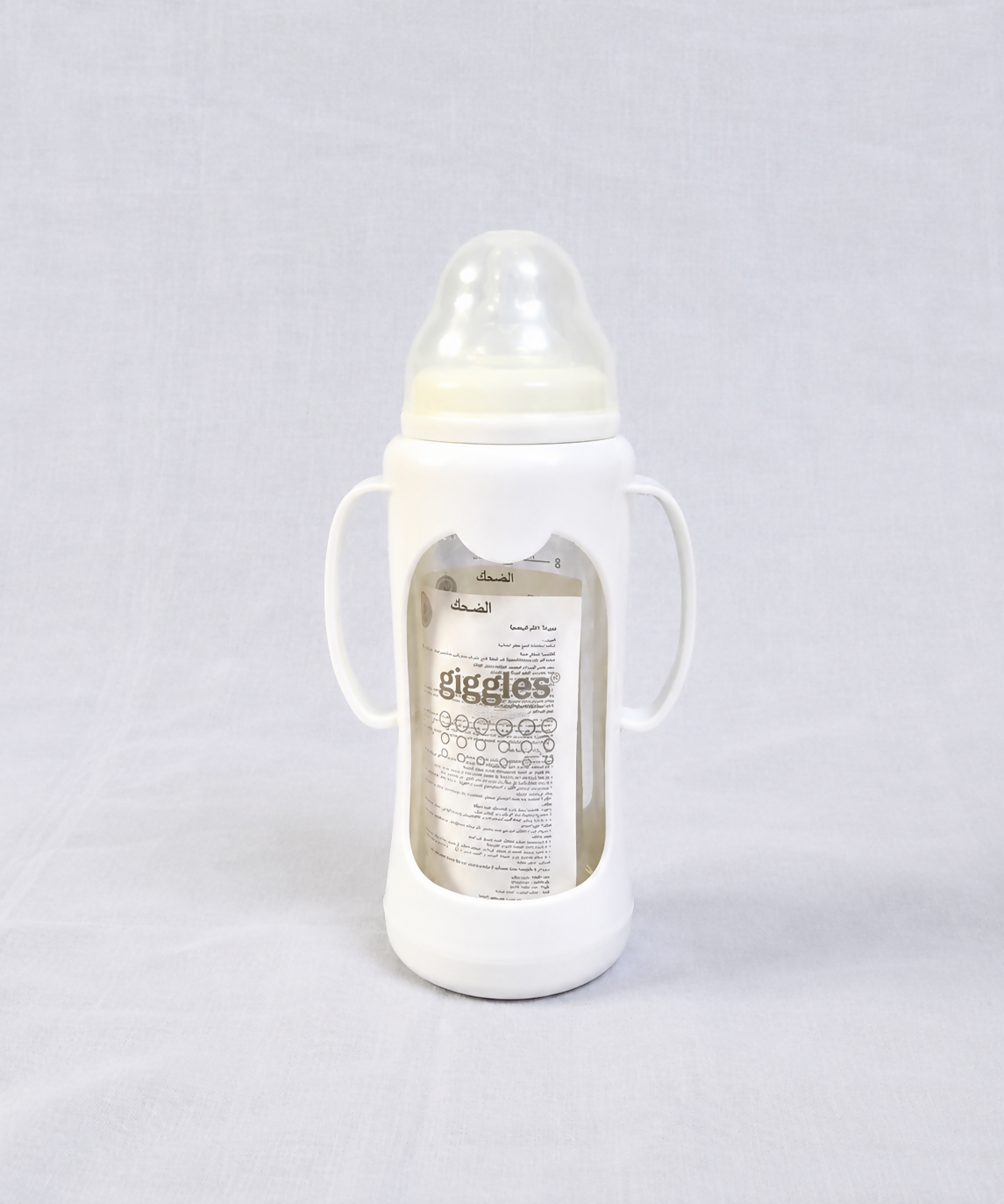Giggles 210ml Glass Feeding Bottle with dual handles, BPA-free glass, soft silicone nipple, and ergonomic design for comfortable, safe, and easy feeding for babies learning to hold a bottle.