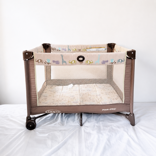 Graco Pack 'N Play Baby Playard Portable Travel Cot B138 in Some Used condition featuring foldable design, breathable mesh sides, animal print, and a spacious enclosed area for supervised play and rest.