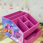 Pink desk organizer with compartments and a drawer, featuring cartoon characters 