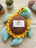 Handmade Crochet Sunflower Turtle Amigurumi Plushie crafted from soft yarn with a charming sunflower shell design, detailed hand-stitched finish, and a cuddly texture for gifting, décor, and imaginative play.