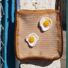 Handmade crochet bag for girls crafted from soft, durable yarn with a stylish design, comfortable strap, and lightweight construction for everyday use, outings, and special occasions.