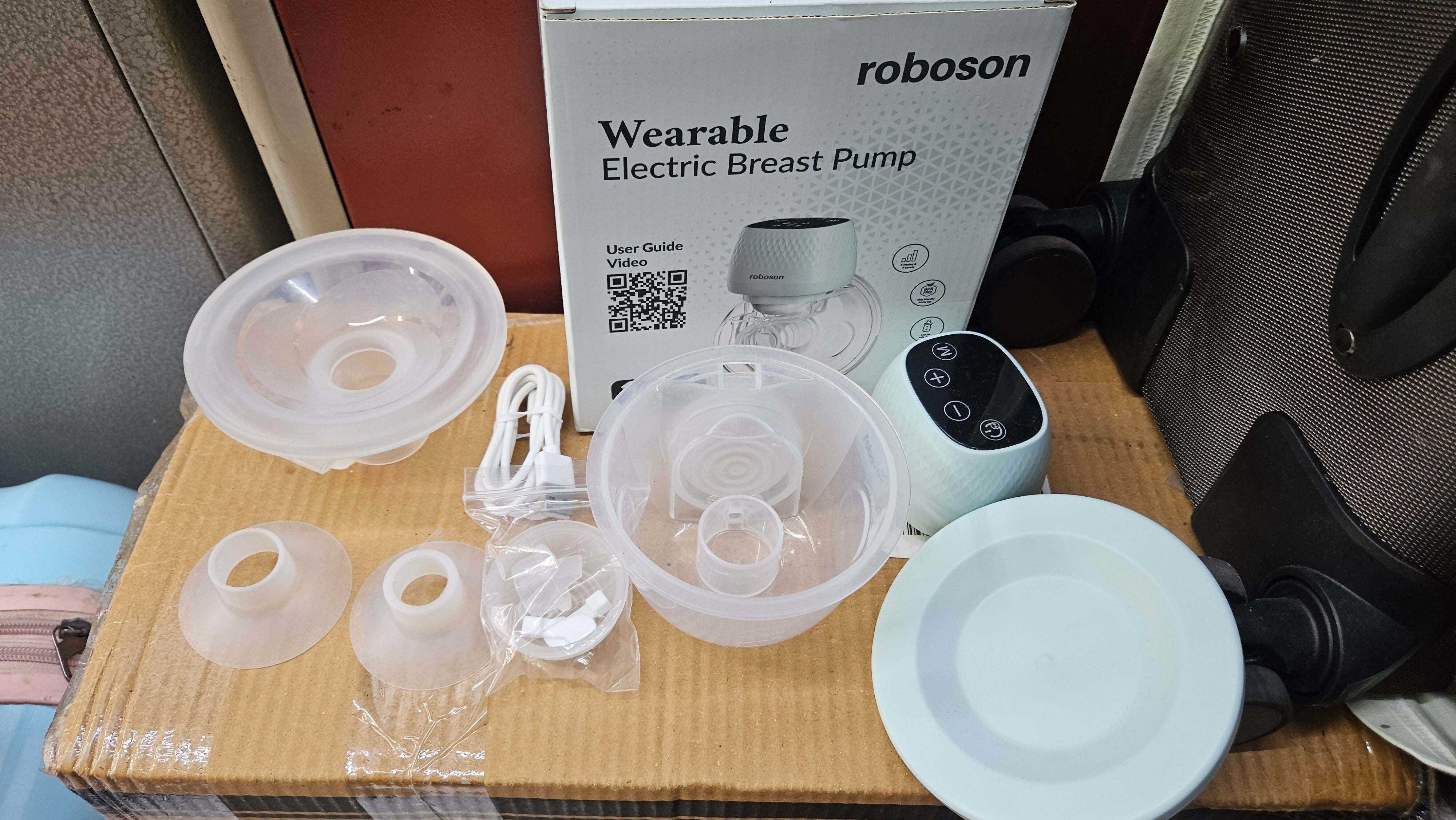 ROBOSON wearable breast pump with hands-free design, compact milk collection cups, adjustable suction settings, and portable pumping support for breastfeeding mothers.
