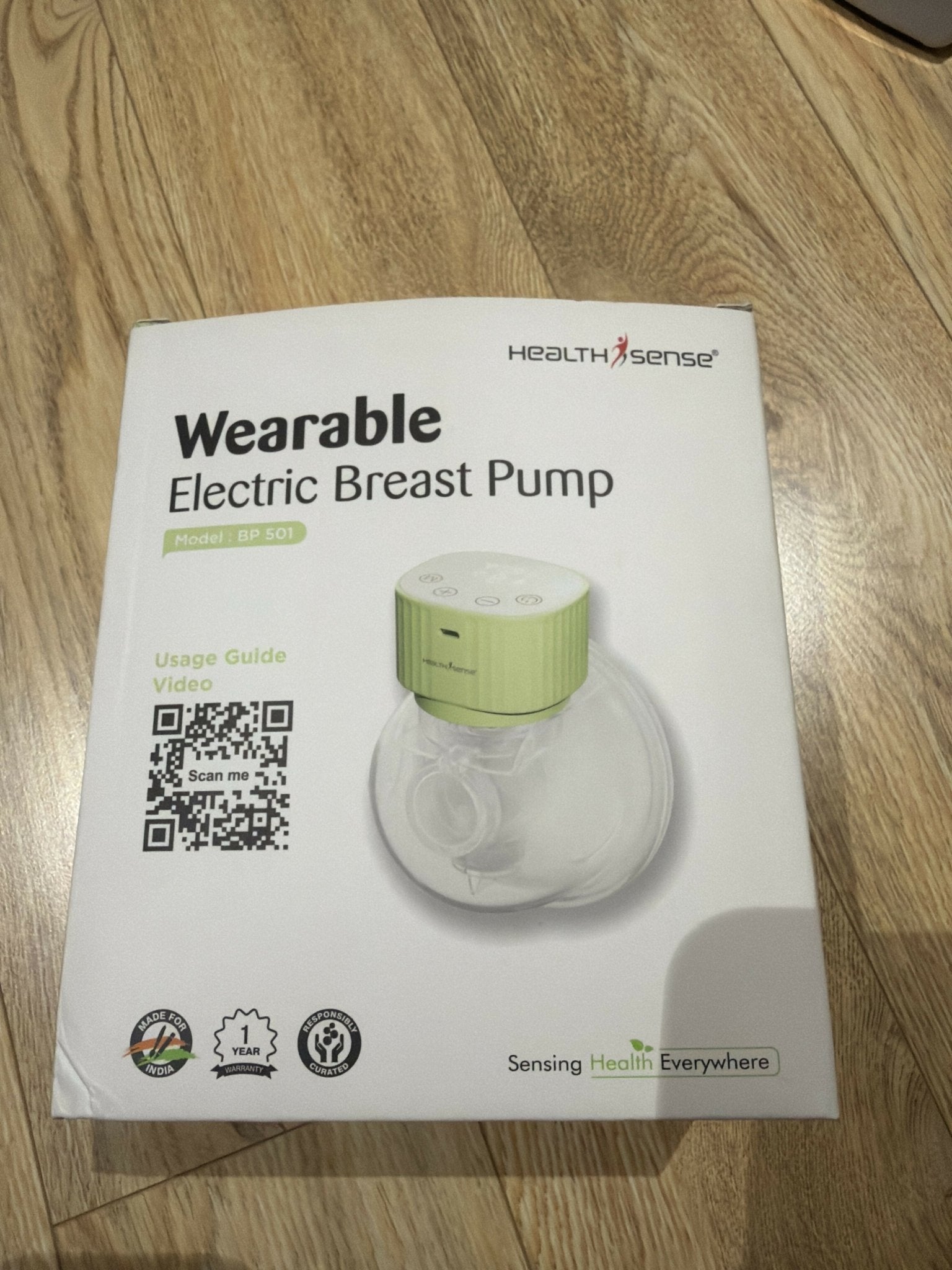 HealthSense Wearable Breast Pump with 3 pumping modes, hands-free wearable design, adjustable suction levels, rechargeable battery, quiet operation, leak-resistant collection cups, and BPA-free components.