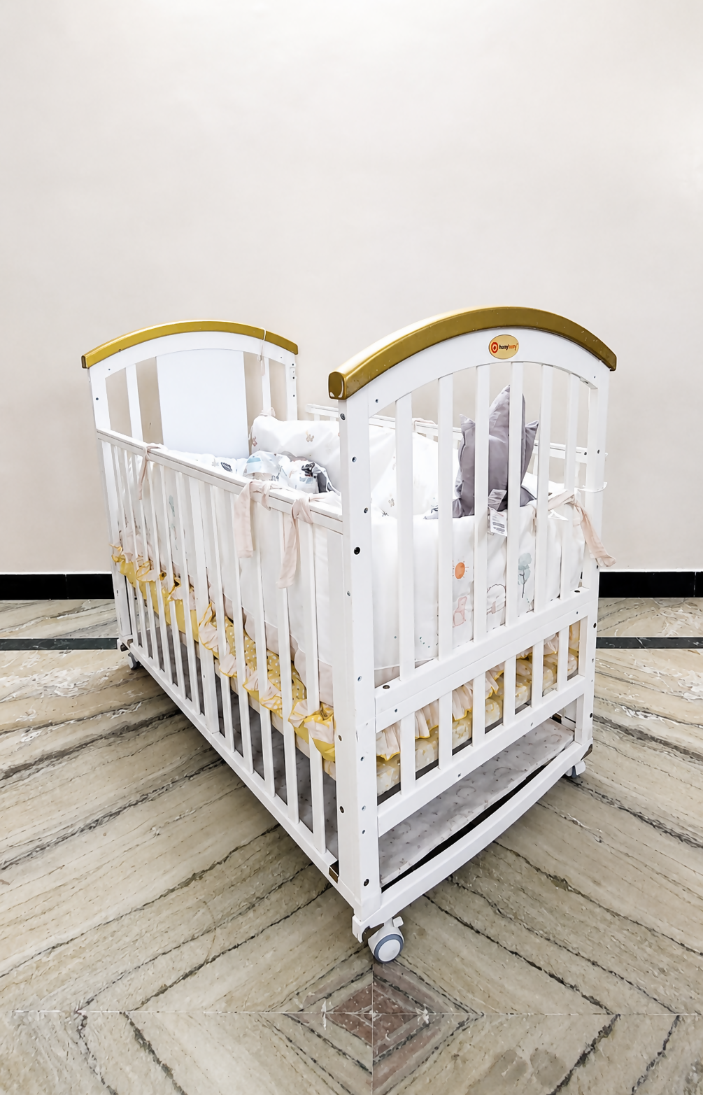 HunyHuny Wooden Baby Cot Crib B102 with rocking function, lockable wheels, included mattress, spacious sleeping area, and a sturdy wooden frame for safe and comfortable sleep.