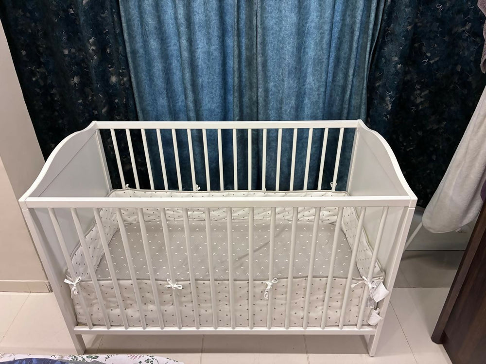 IKEA Baby Cot measuring 60 × 120 cm (23 5/8 × 47 1/4 inches), featuring a simple, practical design with protective side rails and a spacious sleeping area for babies.