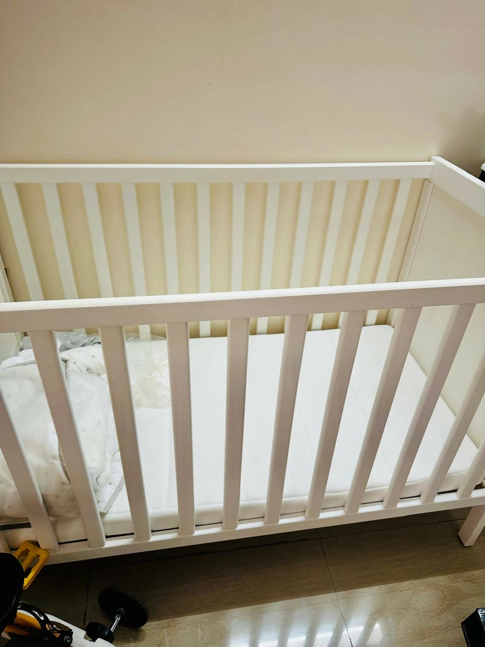 IKEA SUNDVIK Baby Cot in White with mattress and mattress protector, featuring a sturdy wooden frame, adjustable mattress height, classic design, and a safe, comfortable sleeping space for babies.