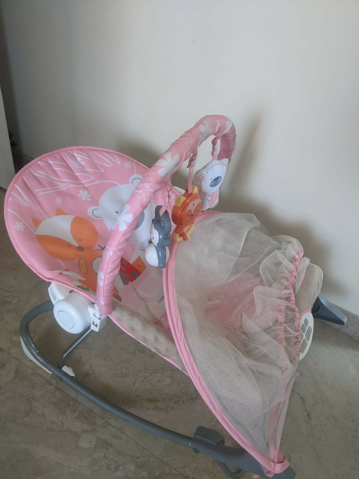 INFANTSO baby rocker and bouncer in pink with cushioned seating, gentle rocking motion, secure safety harness, and comfortable support for baby relaxation, play, and rest.