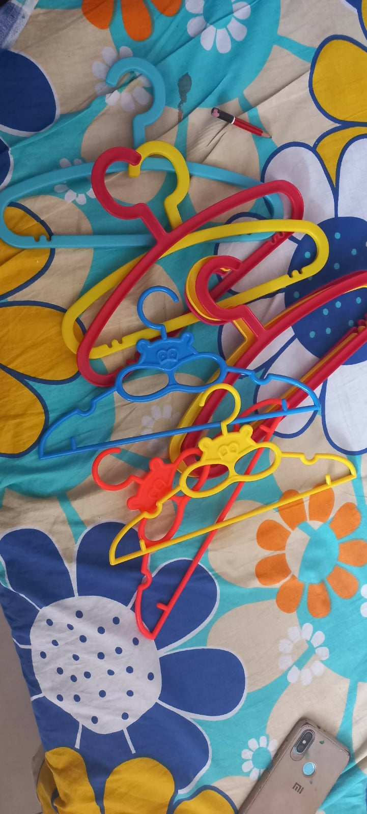 Add a splash of fun and organization to your child's closet with these colorful small hangers, specially designed to hold baby and toddler outfits perfectly. 