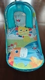 MEE MEE Baby Bather in Some Used condition featuring an ergonomic reclined design, supportive seating, comfortable fabric, and a lightweight frame for convenient supervised baby bath time.