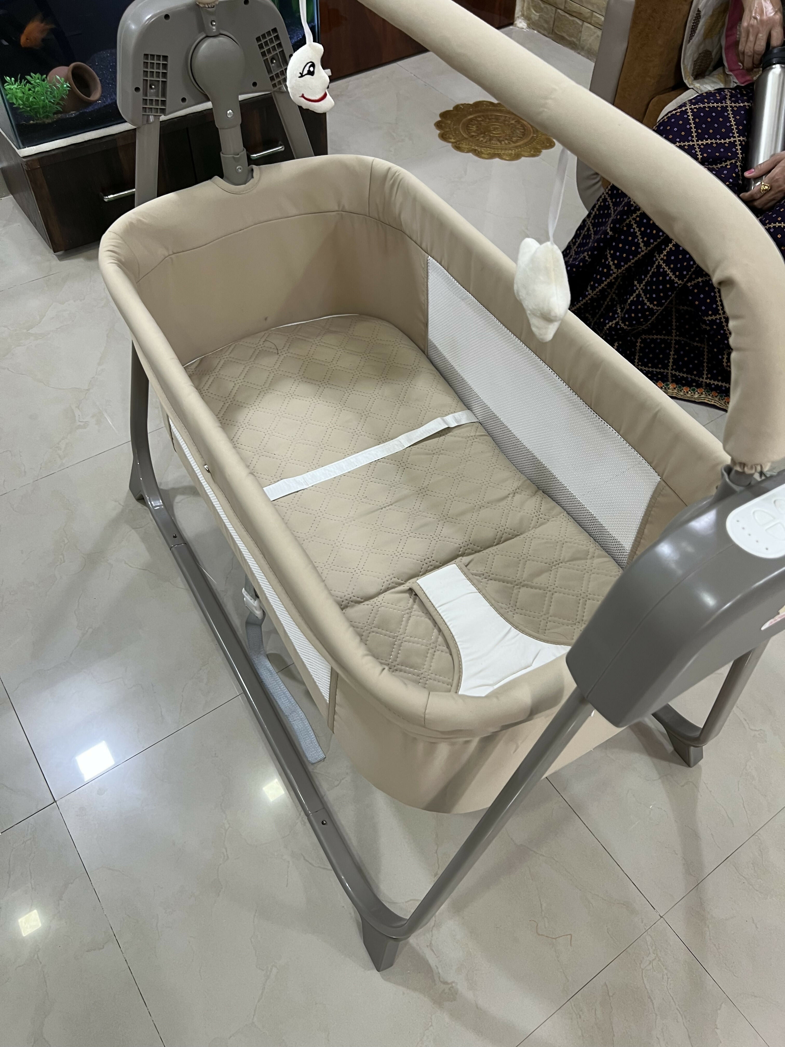 INFANTSO Premium Electric Baby Cradle Swing featuring an electric swinging function, comfortable resting space and supportive design for convenient supervised soothing, relaxing and everyday use with your baby.