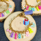 Personalized acrylic initial letter bracelet featuring a custom alphabet charm, durable acrylic finish, adjustable band, and stylish design for kids and adults.
