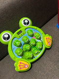 Whack-a-Frog Game for Kids, a fun interactive toy for hand-eye coordination and play.