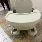 Children's high chair on a patterned rug