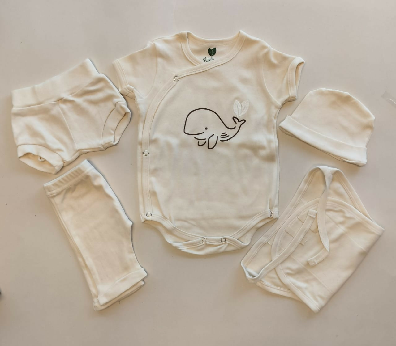 Shop Newborn Baby Clothing Set – Complete cotton essentials with cap, mittens, booties & more, perfect for baby showers and daily use.

