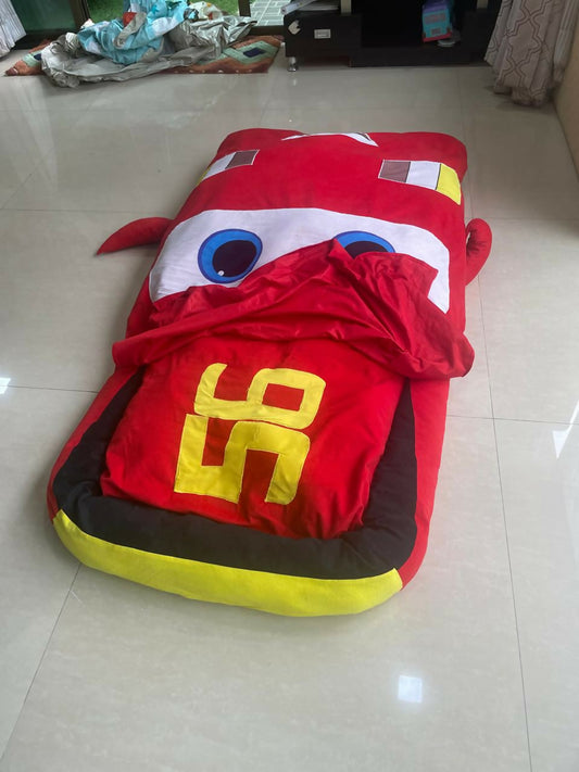 Transform bedtime into a thrilling adventure with the Red Toy Car Bed with Attached Blanket – a vibrant and cozy race car bed that ensures your child stays warm and secure all night.
