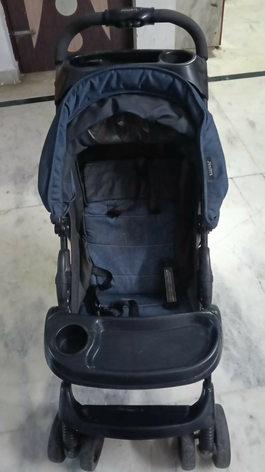 JUNIORS Stroller/Pram for Baby featuring comfortable seating, a protective canopy, sturdy frame and smooth-moving wheels for convenient everyday walks, outings and travel with your baby.