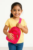Young girl holding a pink backpack against a white background