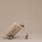 Beige suitcase with a retractable handle on a beige background