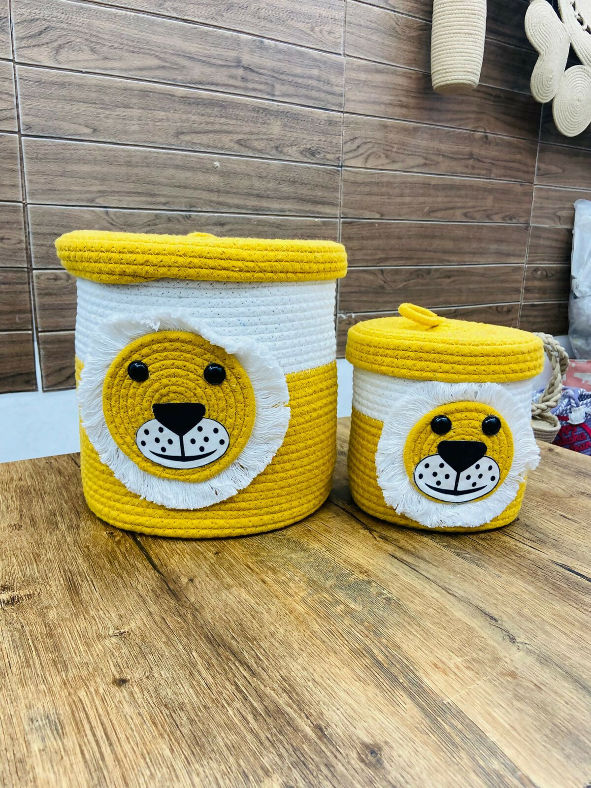 Two lion-themed storage baskets