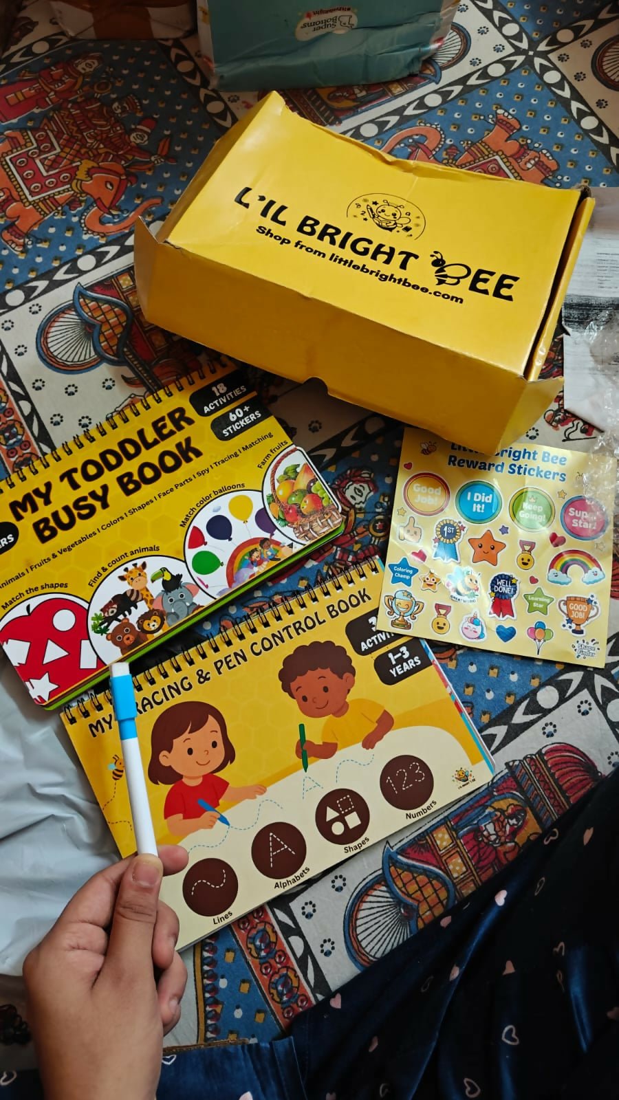 LITTLE BRIGHT BEE Toddler Busy Book with interactive learning activities, colorful illustrations, and reusable pages to encourage fine motor skills, problem-solving, early learning, and independent play.
