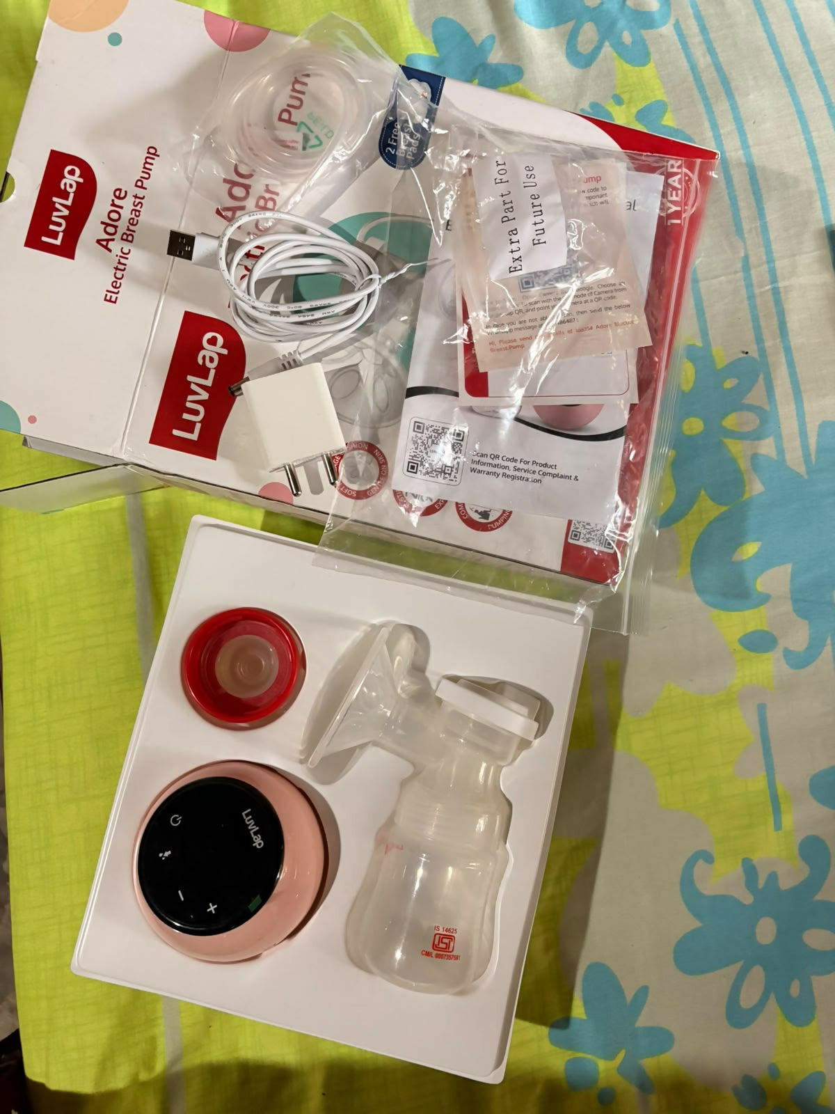 LUVLAP Adore Electric Breast Pump in Almost New condition featuring convenient electric operation, adjustable pumping settings, comfortable breast cushion, and a compact, easy-to-use design for everyday breast milk expression.