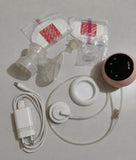 LUVLAP Adore single electric breast pump with adjustable suction settings, compact design, milk collection bottle, and comfortable pumping support for breastfeeding mothers.