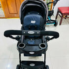 LuvLap baby stroller with lightweight foldable design, reclining seat, adjustable canopy, 5-point safety harness, smooth wheels, and storage basket for comfortable travel with babies and toddlers.