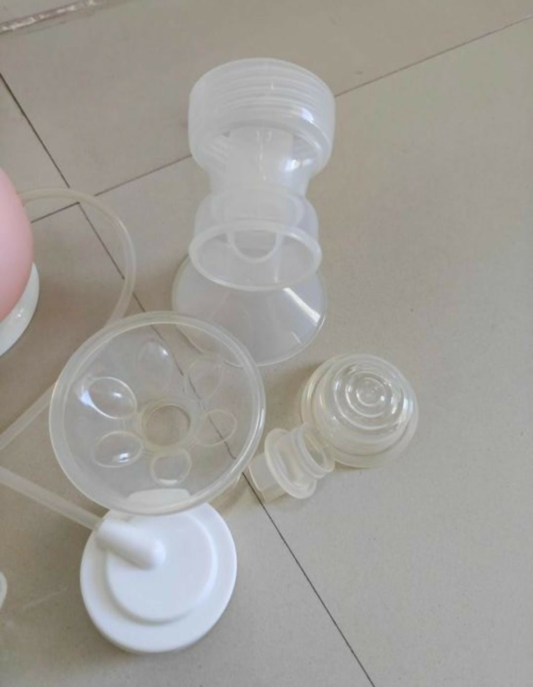 LUVLAP Single Electric Breast Pump with adjustable suction levels, soft silicone massage cushion, quiet operation, rechargeable design, and BPA-free components for comfortable and efficient milk expression.