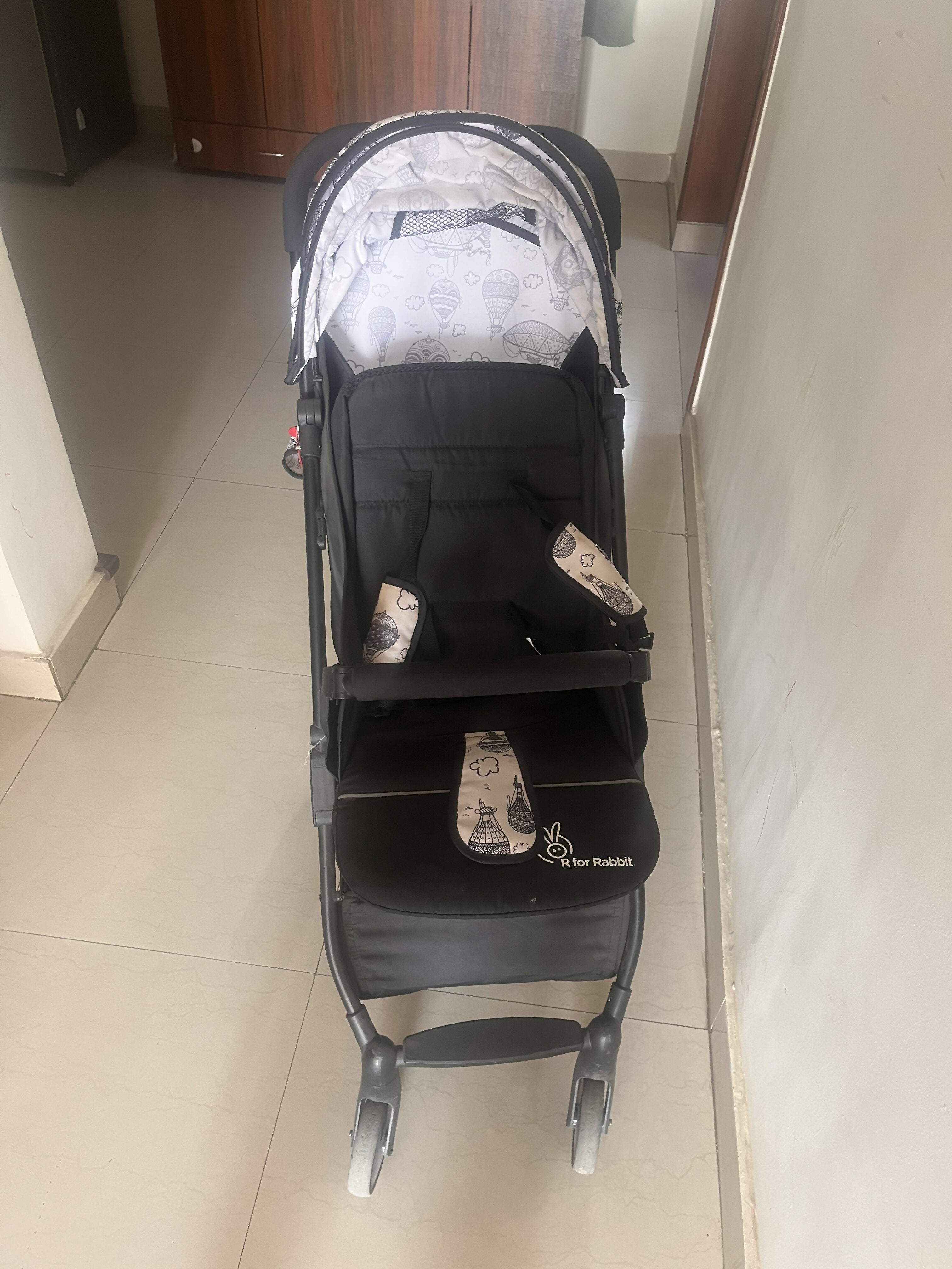 R for Rabbit Pocket Lite stroller with lightweight foldable design, reclining seat, smooth wheels, safety harness, and compact travel-friendly comfort for babies and toddlers.