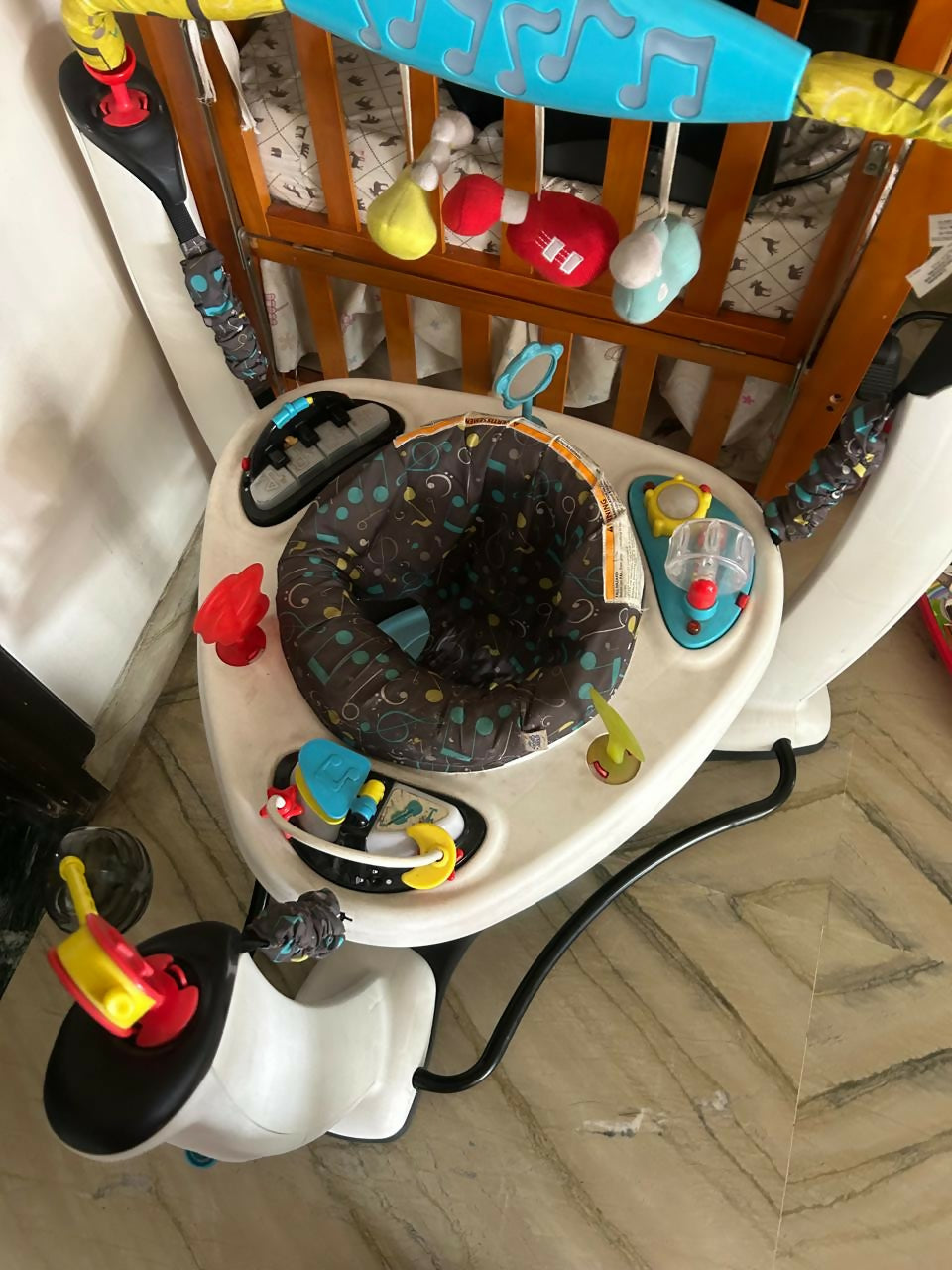 Evenflo Exersaucer jumper – fun, developmental activity center with bouncing seat, rotating toys, lights, and music for baby’s growth journey.

