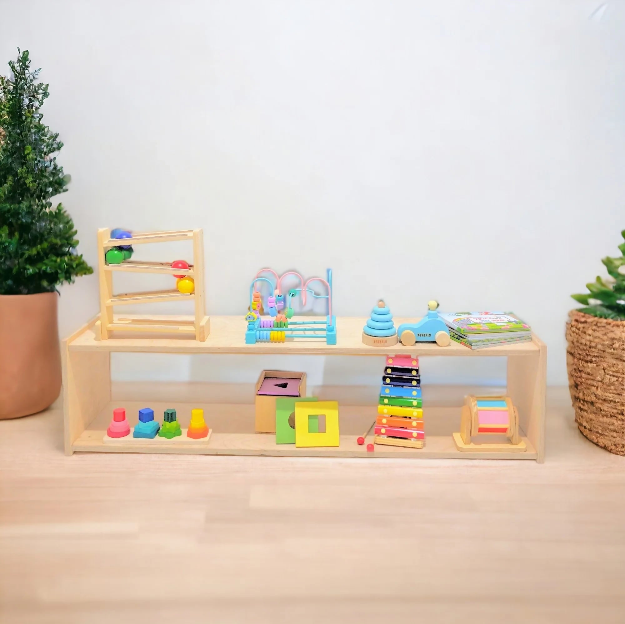 Shop now for the B4BRAIN Montessori Shelf, designed to promote independence and organization with a durable, child-friendly, and minimalist design perfect for any nursery or playroom!