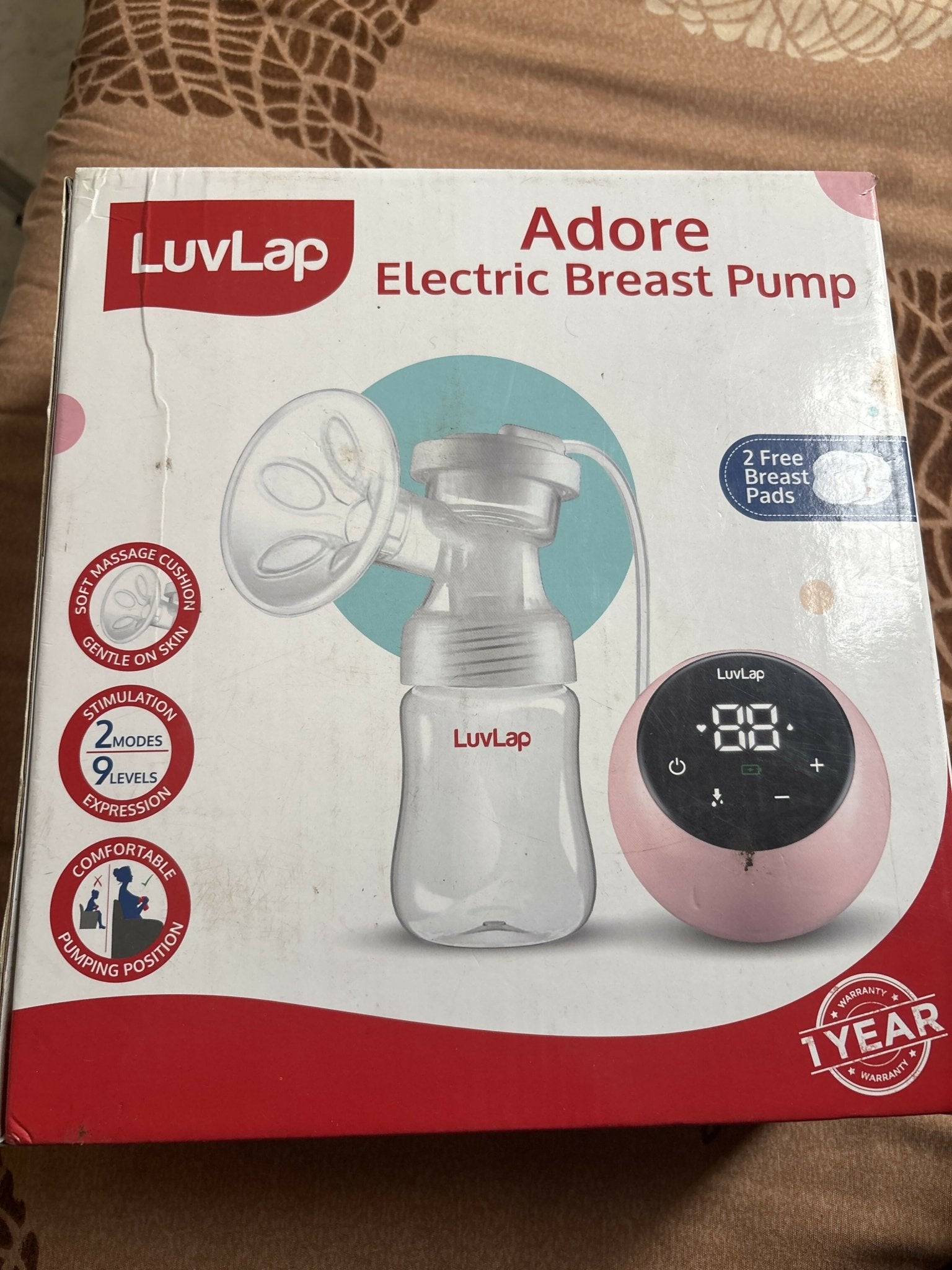 LuvLap Adore Electric Breast Pump with adjustable suction levels, soft silicone breast cushion, multiple expression modes, compact design, and easy-to-use controls for comfortable and convenient milk expression.