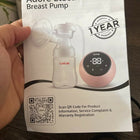 LUVLAP Adore Electric Breast Pump in Preloved New condition featuring convenient electric operation, adjustable pumping settings, comfortable breast cushion, and a compact, easy-to-use design for everyday breast milk expression.