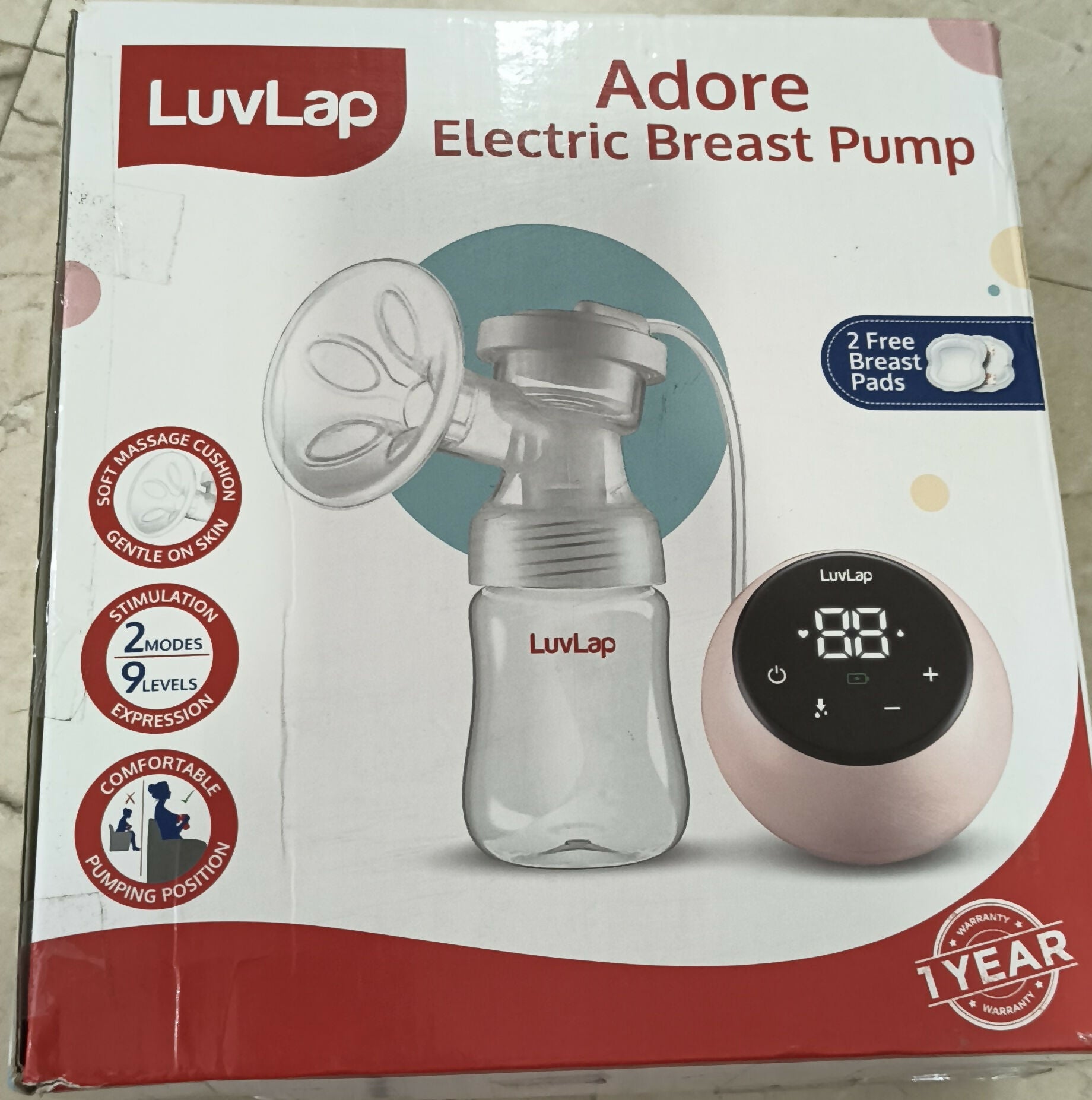 LuvLap Adore Electric Breast Pump featuring 2-phase pumping, rechargeable battery, digital touchscreen, smart memory and dual power mode, with soft breast cushion and 2 breast pads included.