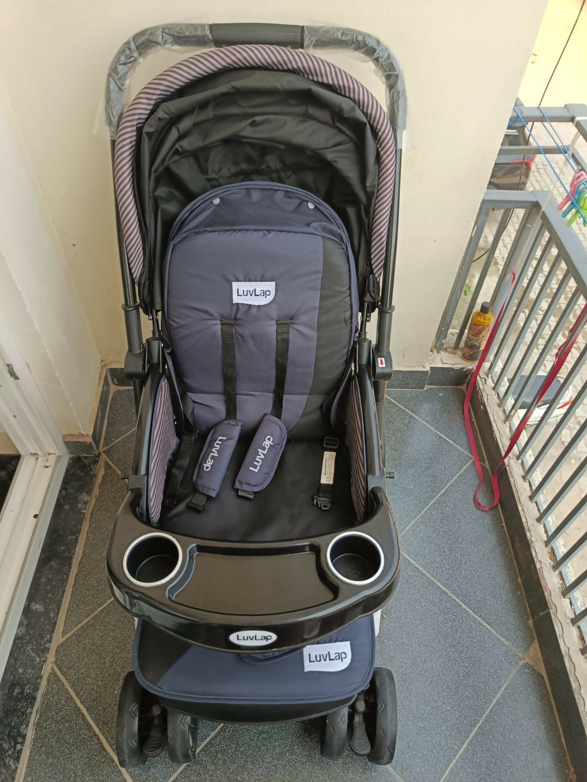 LUVLAP Baby Stroller/Pram in Preloved New condition featuring comfortable seating, protective canopy, safety harness, smooth-moving wheels, and a practical design for everyday walks, shopping, travel, and outings with your baby.