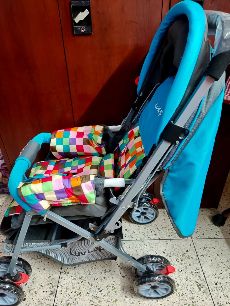 A colourful Luvlap Sunshine baby pram for babies at best price