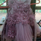 Pink floral dress on a hanger 