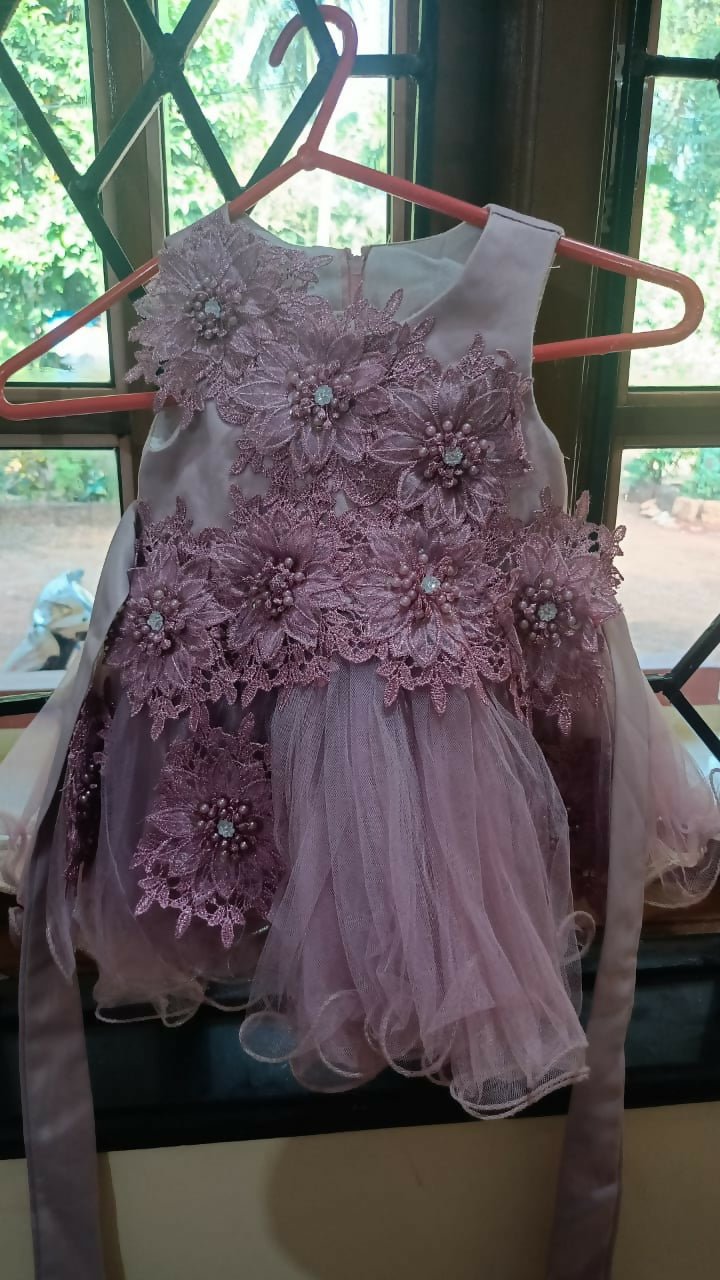 Pink floral dress on a hanger 