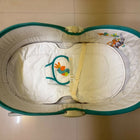 Mastela 5-in-1 Rocker Bassinet in Teal with rocking and bassinet modes, cushioned sleeping area, secure safety harness, and a sturdy multifunctional design for newborns.
