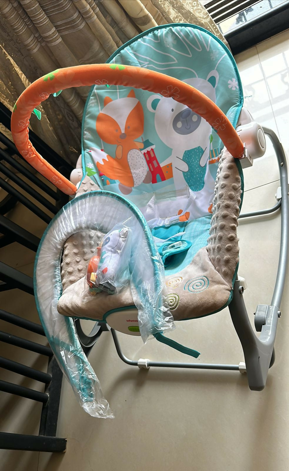 Comfortable and soothing INFANTSO Baby Rocker with adjustable reclining positions and a secure safety harness.