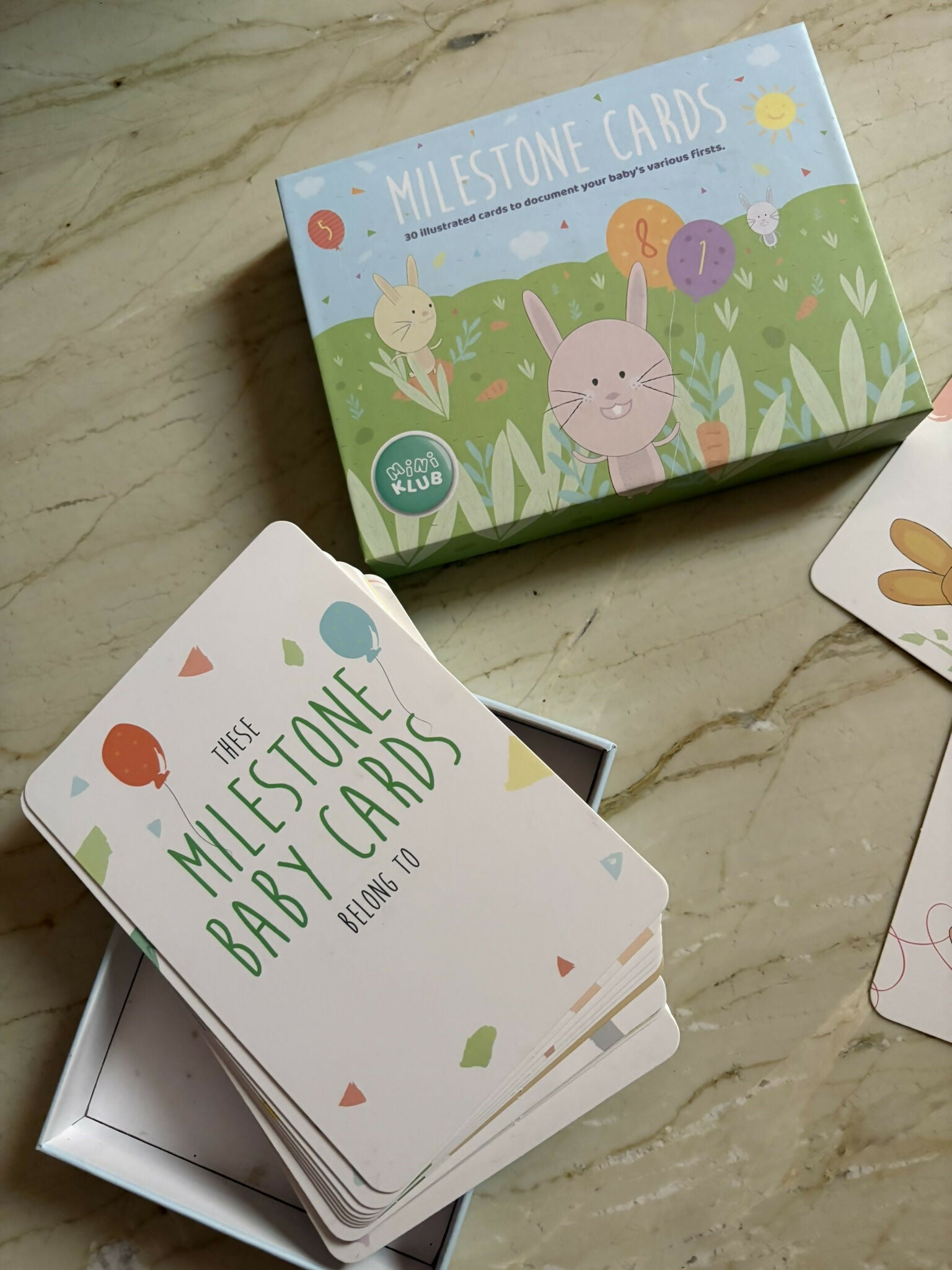 MINIKLUB baby milestone cards set with 30+ cards featuring milestone moments, colorful designs, memory keepsake purpose, and baby photo prop use for capturing special memories.